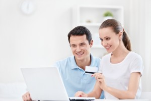 Happy Couple With A Credit Card